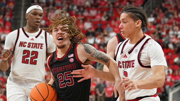 Mar 7, 2026; Raleigh, North Carolina, USA; Stanford Cardinal guard Jeremy Dent-Smith (25) drives the ball around NC State Wolfpack guard Matt Able (3) during the second half at Lenovo Center. Mandatory Credit: Zachary Taft-Imagn Images Mar 7, 2026; Raleigh, North Carolina, USA; Stanford Cardinal guard Jeremy Dent-Smith (25) drives the ball around NC State Wolfpack guard Matt Able (3) during the second half at Lenovo Center. Mandatory Credit: Zachary Taft-Imagn Images
