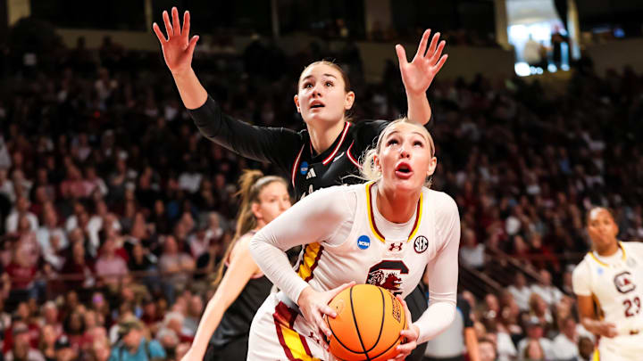 Mar 23, 2025; Columbia, South Carolina, USA; South Carolina Gamecocks forward Chloe Kitts (21) drives around Indiana Hoosiers forward Lilly Meister (52) in the first half at Colonial Life Arena. Mandatory Credit: Jeff Blake-Imagn Images