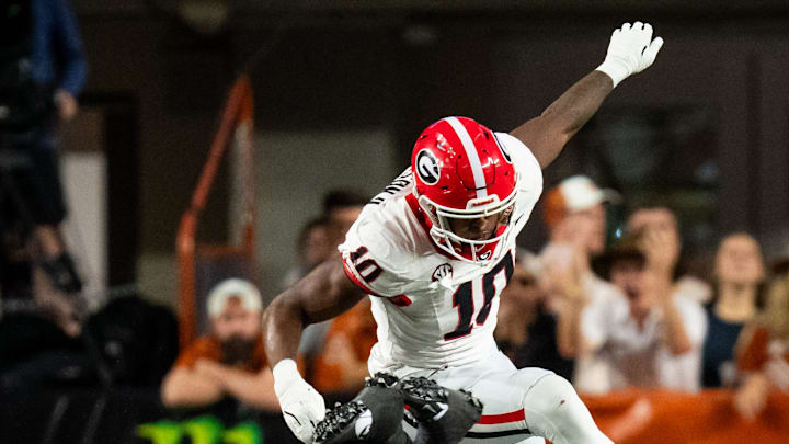 Georgia Bulldogs linebackers Jalon Walker (11) and Damon Wilson II (10) sack Texas Longhorns quarterback Quinn Ewers (3) in the second quarter of the Longhorns' game against the Georgia Bulldogs at Darrell K. Royal Texas Memorial Stadium in Austin, Oct. 19, 2024. Georgia Bulldogs linebackers Jalon Walker (11) and Damon Wilson II (10) sack Texas Longhorns quarterback Quinn Ewers (3) in the second quarter of the Longhorns' game against the Georgia Bulldogs at Darrell K. Royal Texas Memorial Stadium in Austin, Oct. 19, 2024.