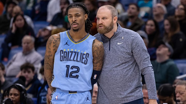 Former Grizzlies coach Taylor Jenkins talks with guard Ja Morant during a game against the Pelicans in December.
