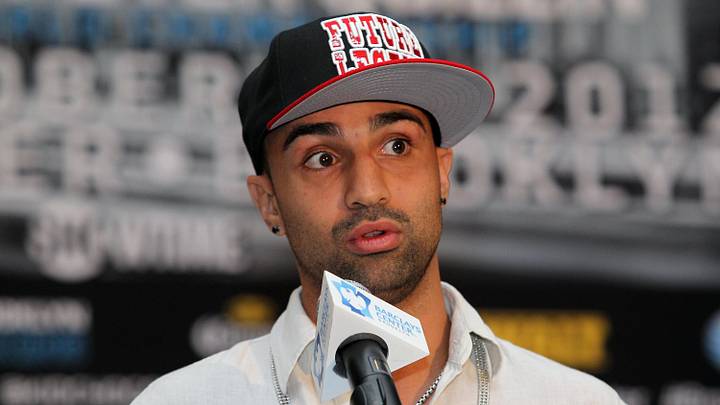 Aug 30, 2012; Brooklyn, NY, USA; WBA welterweight champion Paulie Malignaggi speaks at the press conference at New York Marriott at the Brooklyn Bridge. The press conference announced the upcoming October 20th card at the Barclay's Center.  Mandatory Credit: Ed Mulholland-Imagn Images
