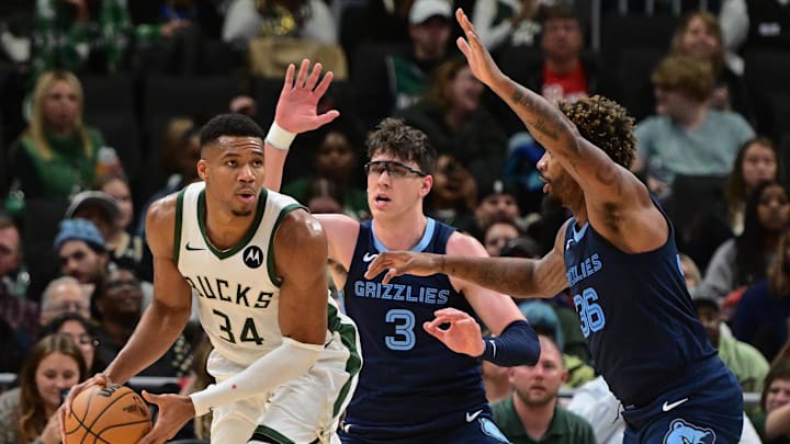 Oct 20, 2023; Milwaukee, Wisconsin, USA; Milwaukee Bucks forward Giannis Antetokounmpo (34) gets pressure from Memphis Grizzlies center Jake LaRavia (3) and guard Marcus Smart (36) at Fiserv Forum. Mandatory Credit: Benny Sieu-Imagn Images Oct 20, 2023; Milwaukee, Wisconsin, USA; Milwaukee Bucks forward Giannis Antetokounmpo (34) gets pressure from Memphis Grizzlies center Jake LaRavia (3) and guard Marcus Smart (36) at Fiserv Forum. Mandatory Credit: Benny Sieu-Imagn Images