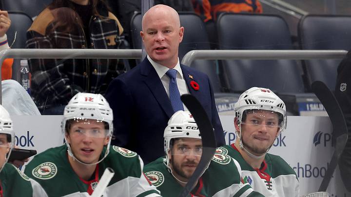 Nov 7, 2025; Elmont, New York, USA; Minnesota Wild head coach John Hynes coaches against the New York Islanders during the first period at UBS Arena. Mandatory Credit: Brad Penner-Imagn Images
