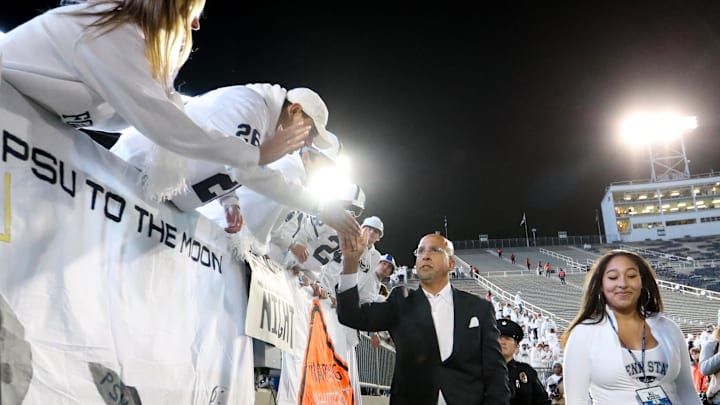 Penn State coach James Franklin shakes hands with the fans upon team arrival prior to the game against the Washington Huskies at Beaver Stadium. 