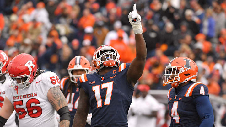 Nov 1, 2025; Champaign, Illinois, USA;  Illinois Fighting Illini linebacker Gabe Jacas (17) celebrates his sack on Rutgers Scarlet Knights quarterback Athan Kaliakmanis (16) during the first half at Memorial Stadium. Mandatory Credit: Ron Johnson-Imagn Images