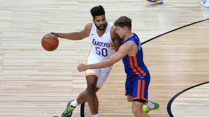 Aug 11, 2021; Las Vegas, Nevada, USA; Los Angeles Lakers forward Yoeli Childs (50) dribbles against New York Knicks guard Rokas Jokubaitis (0) during an NBA Summer League game at Thomas & Mack Center. Mandatory Credit: Stephen R. Sylvanie-USA TODAY Sports
