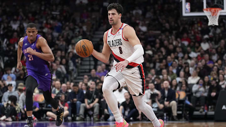 Apr 3, 2025; Toronto, Ontario, CAN; Portland Trail Blazers forward Deni Avdija (8) dribbles up court as Toronto Raptors center Orlando Robinson (21) defends during the second half at Scotiabank Arena. Mandatory Credit: John E. Sokolowski-Imagn Images Apr 3, 2025; Toronto, Ontario, CAN; Portland Trail Blazers forward Deni Avdija (8) dribbles up court as Toronto Raptors center Orlando Robinson (21) defends during the second half at Scotiabank Arena. Mandatory Credit: John E. Sokolowski-Imagn Images