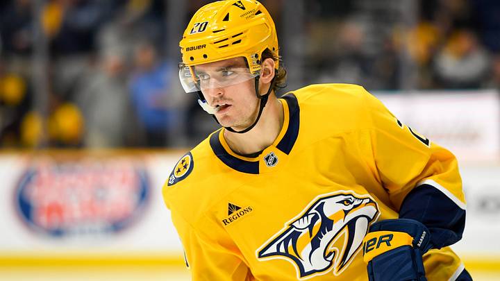 Apr 8, 2025; Nashville, Tennessee, USA;   Nashville Predators defenseman Justin Barron (20) warms up before a game against the New York Islanders at Bridgestone Arena. Mandatory Credit: Steve Roberts-Imagn Images