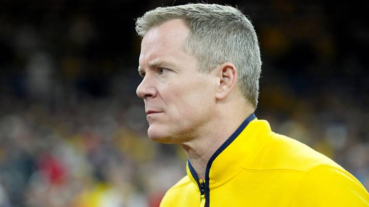 Michigan Wolverines head coach Dusty May walks onto the court Monday, April 6, 2026, ahead of the NCAA men's basketball tournament national championship game against the UConn Huskies at Lucas Oil Stadium in Indianapolis. Michigan Wolverines head coach Dusty May walks onto the court Monday, April 6, 2026, ahead of the NCAA men's basketball tournament national championship game against the UConn Huskies at Lucas Oil Stadium in Indianapolis.