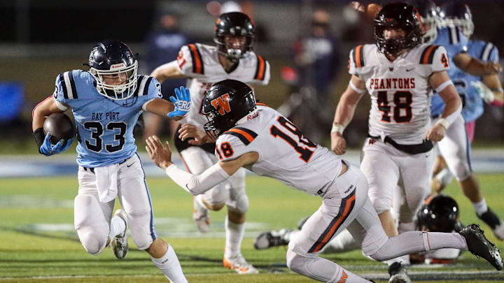 Bay Port High School's Brady Moon (33) stiff-arms West De Pere High School's Brandon Schaefer (18) on Friday, October 11, 2024, at Bay Port High School in Suamico, Wis. West De Pere won the game, 45-43, on a 49-yard field goal as time expired.
Tork Mason/USA TODAY NETWORK-Wisconsin Bay Port High School's Brady Moon (33) stiff-arms West De Pere High School's Brandon Schaefer (18) on Friday, October 11, 2024, at Bay Port High School in Suamico, Wis. West De Pere won the game, 45-43, on a 49-yard field goal as time expired.
Tork Mason/USA TODAY NETWORK-Wisconsin