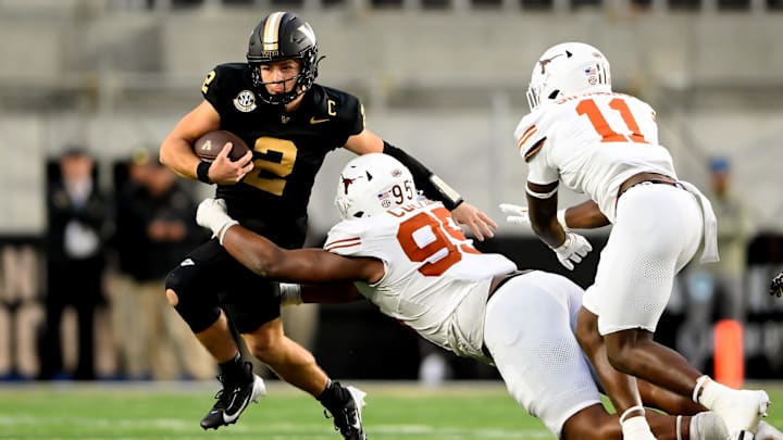 Texas Longhorns defensive lineman Alfred Collins tackles Vanderbilt Commodores quarterback Diego Pavia for a loss during the second half at FirstBank Stadium. Texas Longhorns defensive lineman Alfred Collins tackles Vanderbilt Commodores quarterback Diego Pavia for a loss during the second half at FirstBank Stadium.