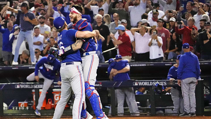 Texas Rangers relief pitcher Josh Sborz (66) celebrates with catcher Jonah Heim (28) after beating