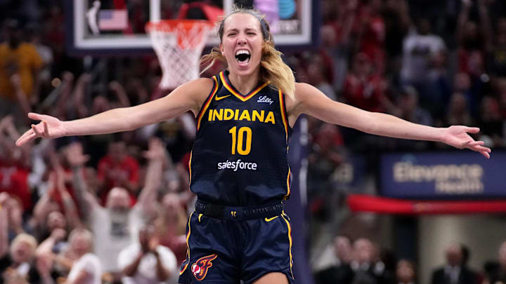 Indiana Fever guard Lexie Hull (10) celebrates after scoring a three-point field goal during the second half of a game against the Seattle Storm on Sunday, Aug. 18, 2024, at Gainbridge Fieldhouse in Indianapolis. The Fever defeated the Storm 92-75.