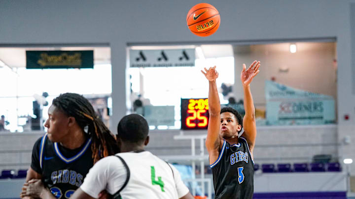 Gibbs Gladiators guard Oneal Delancy (5) shoots the ball during the first quarter of the City of Palms Classic sunshine series championship game against the St. Joseph Knights at Suncoast Credit Union Arena in Fort Myers, Fla., on Saturday, Dec. 21, 2024.