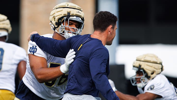 Notre Dame offensive lineman Charles Jagusah (56) participates in a drill during a Notre Dame football practice at Irish Athletic Center on Thursday, Aug. 1, 2024, in South Bend. Notre Dame offensive lineman Charles Jagusah (56) participates in a drill during a Notre Dame football practice at Irish Athletic Center on Thursday, Aug. 1, 2024, in South Bend.