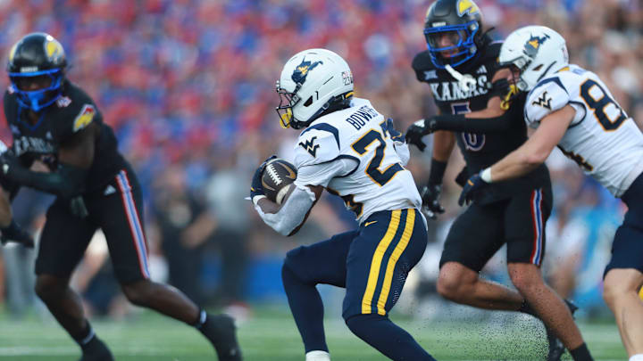 West Virginia Mountaineers running back Cyncir Bowers (23) runs the ball during the first half of the game against Kansas Jayhawks at David Booth Kansas Memorial Stadium on Sept. 20, 2025.