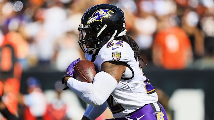 Oct 6, 2024; Cincinnati, Ohio, USA; Baltimore Ravens running back Derrick Henry (22) runs with the ball against the Cincinnati Bengals in the first half at Paycor Stadium. Mandatory Credit: Katie Stratman-Imagn Images