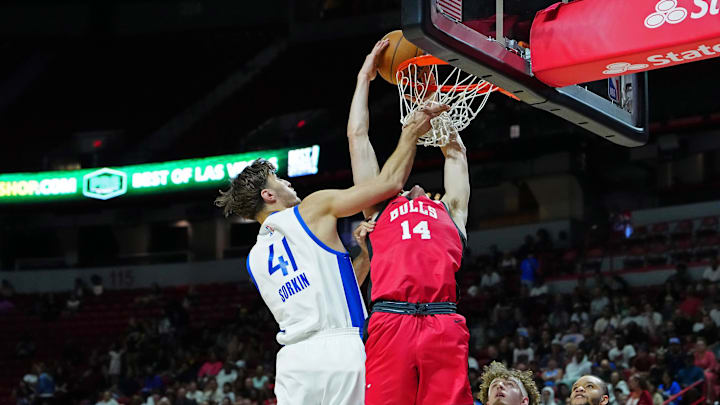 Jul 14, 2024; Las Vegas, NV, USA; Chicago Bulls forward Matas Buzelis (14) dunks against Golden State Warriors center Roman Sorkin (41): Stephen R. Sylvanie-USA TODAY Sports