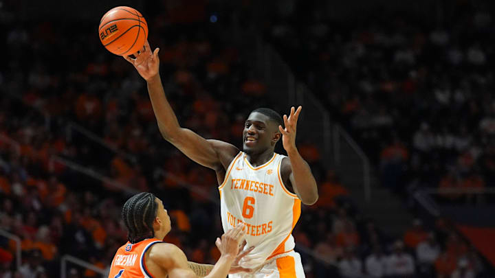 Tennessee forward DeWayne Brown II (6) passes the ball in front of Auburn's Elyjah Freeman (6) during a NCAA basketball game between the Tennessee Volunteers and Auburn Tigers at Thompson-Boling Arena at Food City Center in Knoxville, Tenn., on Jan. 31, 2026.