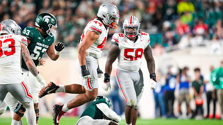 Sep 28, 2024; East Lansing, Michigan, USA; Ohio State Buckeyes defensive end JT Tuimoloau (44) reacts in the first half at Spartan Stadium on Saturday.