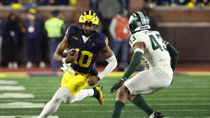 Oct 26, 2024; Ann Arbor, Michigan, USA; Michigan Wolverines quarterback Alex Orji (10) rushes in the second half against the Michigan State Spartans at Michigan Stadium. Mandatory Credit: Rick Osentoski-Imagn Images Oct 26, 2024; Ann Arbor, Michigan, USA; Michigan Wolverines quarterback Alex Orji (10) rushes in the second half against the Michigan State Spartans at Michigan Stadium. Mandatory Credit: Rick Osentoski-Imagn Images
