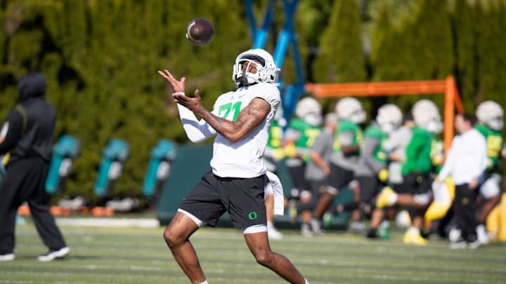 Oregon wide receiver Ryan Pellum returns the ball during practice with the Ducks Thursday, April 18, 2024, at the Hatfield-Dowlin Complex in Eugene, Ore.