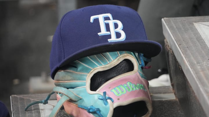 Sep 26, 2025; Toronto, Ontario, CAN; The hat and glove of Tampa Bay Rays third baseman Junior Caminero (13) in the dugout during the game against the Toronto Blue Jays at Rogers Centre. Sep 26, 2025; Toronto, Ontario, CAN; The hat and glove of Tampa Bay Rays third baseman Junior Caminero (13) in the dugout during the game against the Toronto Blue Jays at Rogers Centre.