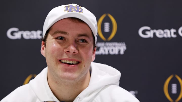 Jan 18, 2025; Atlanta, GA, USA; Notre Dame Fighting Irish quarterback Riley Leonard (13) talks to the media during 2025 CFP National Championship Media Day at Georgia World Congress Center, Building A.