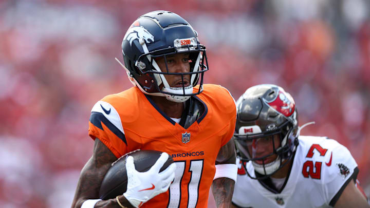 Sep 22, 2024; Tampa, Florida, USA; Denver Broncos wide receiver Josh Reynolds (11) makes a catch against the Tampa Bay Buccaneers in the first quarter at Raymond James Stadium.