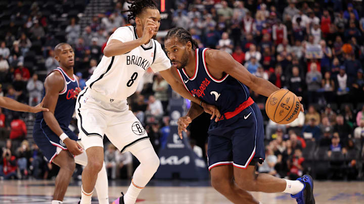 Jan 15, 2025; Inglewood, California, USA;  LA Clippers forward Kawhi Leonard (2) dribbles against Brooklyn Nets forward Ziaire Williams (8) during the first half at Intuit Dome. Mandatory Credit: Kiyoshi Mio-Imagn Images
