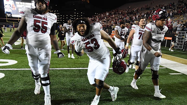 Nov 5, 2022; Nashville, Tennessee, USA; South Carolina Gamecocks offensive lineman Jakai Moore (55) and offensive lineman Vershon Lee (53) celebrate being bowl eligible after a win against the Vanderbilt Commodores at FirstBank Stadium. Mandatory Credit: Christopher Hanewinckel-Imagn Images Nov 5, 2022; Nashville, Tennessee, USA; South Carolina Gamecocks offensive lineman Jakai Moore (55) and offensive lineman Vershon Lee (53) celebrate being bowl eligible after a win against the Vanderbilt Commodores at FirstBank Stadium. Mandatory Credit: Christopher Hanewinckel-Imagn Images