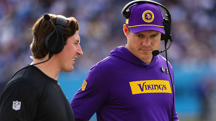 Vikings assistant quarterbacks coach Grant Udinski chats with head coach Kevin O'Connell