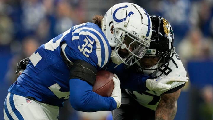 Jacksonville Jaguars wide receiver Josh Reynolds (87) works to bring down Indianapolis Colts safety Julian Blackmon (32) after he intercepted a pass Sunday, Jan. 5, 2025, during a game against the Jacksonville Jaguars at Lucas Oil Stadium in Indianapolis. Jacksonville Jaguars wide receiver Josh Reynolds (87) works to bring down Indianapolis Colts safety Julian Blackmon (32) after he intercepted a pass Sunday, Jan. 5, 2025, during a game against the Jacksonville Jaguars at Lucas Oil Stadium in Indianapolis.