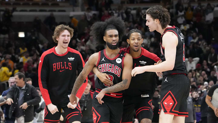 Mar 27, 2025; Chicago, Illinois, USA; Chicago Bulls guard Coby White (0) celebrates his three point basket against the Los Angeles Lakers with guard Josh Giddey (3) and teammates during the second half at United Center. Mandatory Credit: David Banks-Imagn Images