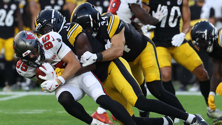 Aug 16, 2025; Pittsburgh, Pennsylvania, USA;  Pittsburgh Steelers wide receiver Brandon Johnson (11) and linebacker Carson Bruener (44) tackle Tampa Bay Buccaneers wide receiver Garrett Greene (85) on a kick-off return during the first quarter at Acrisure Stadium. Mandatory Credit: Charles LeClaire-Imagn Images
