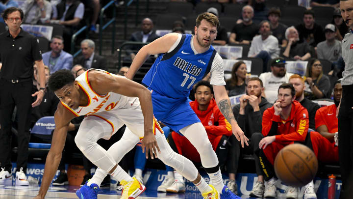 Apr 4, 2024; Dallas, Texas, USA; Dallas Mavericks guard Luka Doncic (77) knocks the ball away from