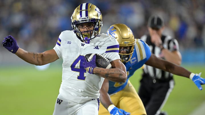 Nov 22, 2025; Pasadena, California, USA;  Washington Huskies wide receiver Omari Evans (5) is forced out of bounds after a 9-yard gain during the first half against the UCLA Bruins at the Rose Bowl. Mandatory Credit: Jayne Kamin-Oncea-Imagn Images