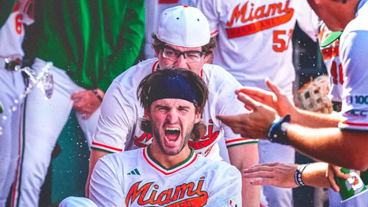 Miami Hurricanes Pitcher Griffin Hugus pushing Bobby Marsh in celebrations after a Grand Slam against Princeton. 