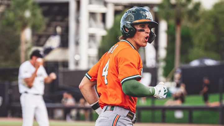 Miami Hurricanes second baseman Jake Ogden ( No. 4) after a home run in the first inning against UCF.