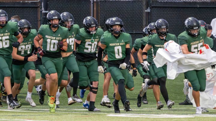 Mountain Vista runs on the field in a game against Cherokee Trail