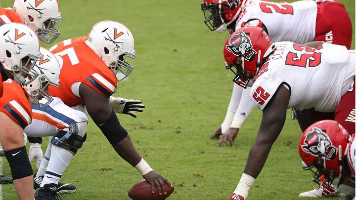 Virginia and NC State, battling in the trenches. Virginia and NC State, battling in the trenches.