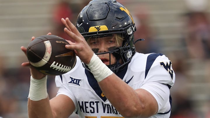 Nov 1, 2025; Houston, Texas, USA; West Virginia Mountaineers quarterback Scotty Fox Jr. (15) takes a snap against the Houston Cougars in the first half at TDECU Stadium. Mandatory Credit: Thomas Shea-Imagn Images Nov 1, 2025; Houston, Texas, USA; West Virginia Mountaineers quarterback Scotty Fox Jr. (15) takes a snap against the Houston Cougars in the first half at TDECU Stadium. Mandatory Credit: Thomas Shea-Imagn Images