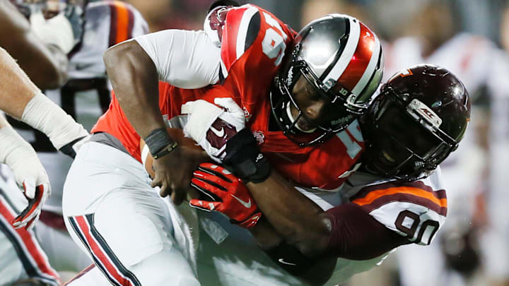 Ohio State Buckeyes quarterback J.T. Barrett (16) gets sacked by Virginia Tech Hokies defensive end Dadi Nicolas (90) in the 4th quarter at Ohio Stadium September 6, 2014. Ohio State Buckeyes quarterback J.T. Barrett (16) gets sacked by Virginia Tech Hokies defensive end Dadi Nicolas (90) in the 4th quarter at Ohio Stadium September 6, 2014.