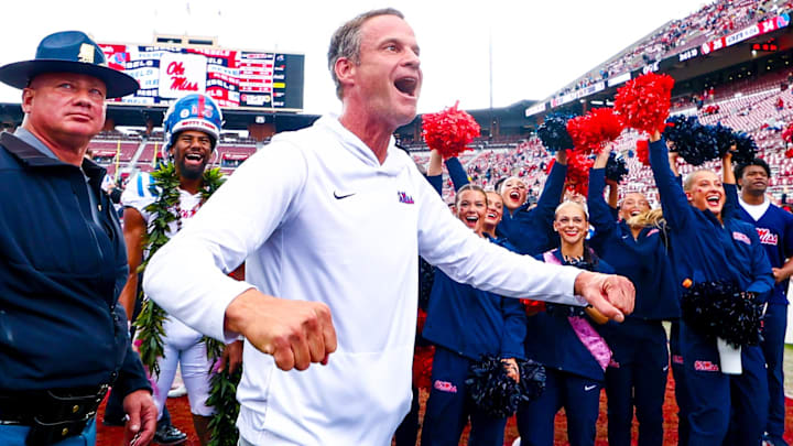 Oct 25, 2025; Norman, Oklahoma, USA; Ole Miss Rebels head coach Lane Kiffin celebrates with fans after the game against the Oklahoma Sooners at Gaylord Family-Oklahoma Memorial Stadium. Mandatory Credit: Kevin Jairaj-Imagn Images Oct 25, 2025; Norman, Oklahoma, USA; Ole Miss Rebels head coach Lane Kiffin celebrates with fans after the game against the Oklahoma Sooners at Gaylord Family-Oklahoma Memorial Stadium. Mandatory Credit: Kevin Jairaj-Imagn Images