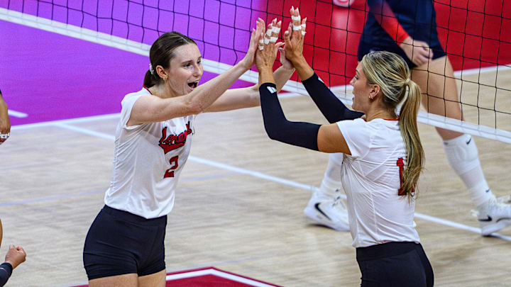 Bergen Reilly high fives Andi Jackson after a point. Jackson led the Huskers against Iowa with 10 kills on a .571 hitting percentage 