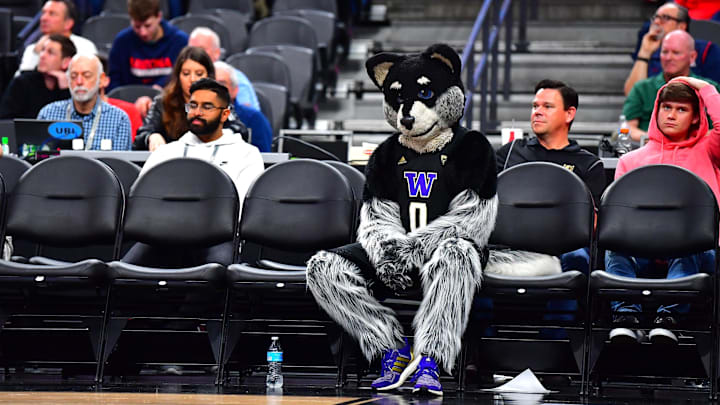 Mar 14, 2020; Las Vegas, Nevada, USA; Washington Huskies mascot Harry the Husky sits in a row of empty chairs on the floor during the second half of an NCAA tournament game between the Huskies and the Arizona Wildcats at Mobile Arena. Mandatory Credit: Stephen R. Sylvanie-Imagn Images