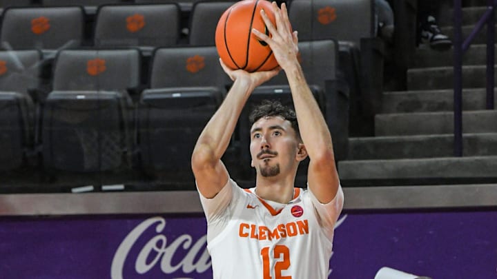 Clemson guard Alex Hemenway (12) shoots a three-point shot 