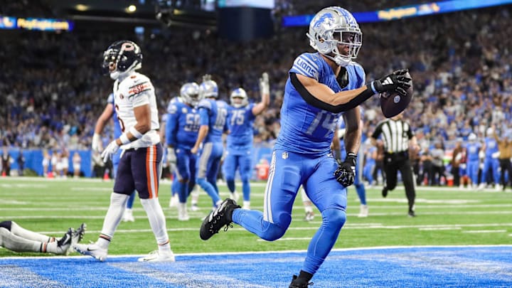 Detroit Lions receiver Amon-Ra St. Brown celebrates a touchdown against the Chicago Bears at the end of the first half at Ford Field on Sunday, Nov. 19, 2023.