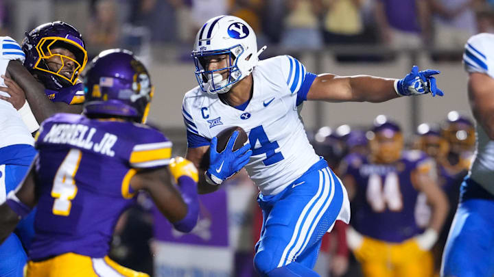 Sep 20, 2025; Greenville, North Carolina, USA; Brigham Young Cougars running back LJ Martin (4) runs with the ball against the East Carolina Pirates during the second half at Dowdy-Ficklen Stadium. Sep 20, 2025; Greenville, North Carolina, USA; Brigham Young Cougars running back LJ Martin (4) runs with the ball against the East Carolina Pirates during the second half at Dowdy-Ficklen Stadium.