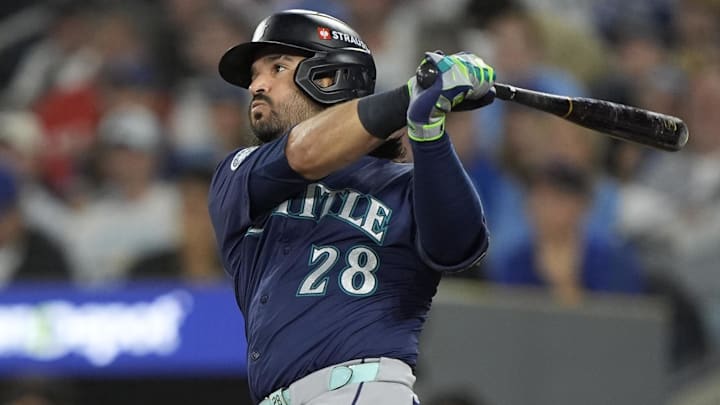 Oct 20, 2025; Toronto, Ontario, CAN; Seattle Mariners third baseman Eugenio Suarez (28) hits a single against the Toronto Blue Jays in the second inning during game seven of the ALCS round for the 2025 MLB playoffs at Rogers Centre.  Mandatory Credit: John E. Sokolowski-Imagn Images